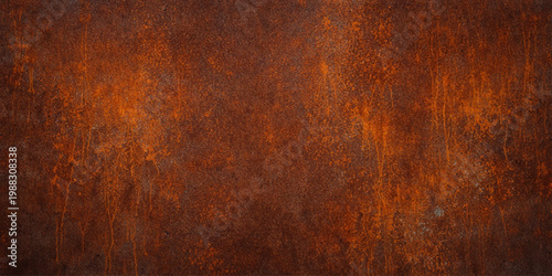 A weathered vintage backdrop featuring a rough, aged steel surface with an orange and brown corrosion pattern on a grungy, textured old rusty metal wall material