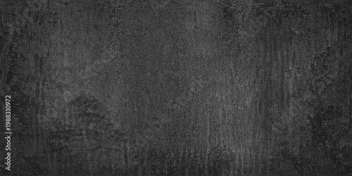 A dark textured black leather surface with a rough grain pattern and macro textile material backdrop for an old grunge wallpaper background