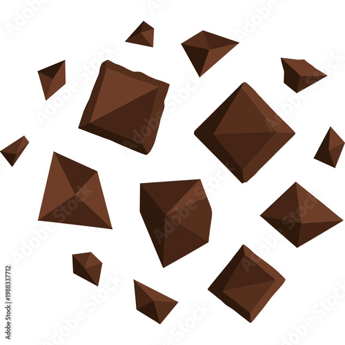 Brown chocolate pieces are scattered on white background in kitchen