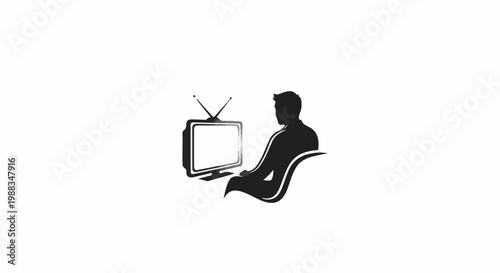 Silhouette of a person seated watching an old television set
