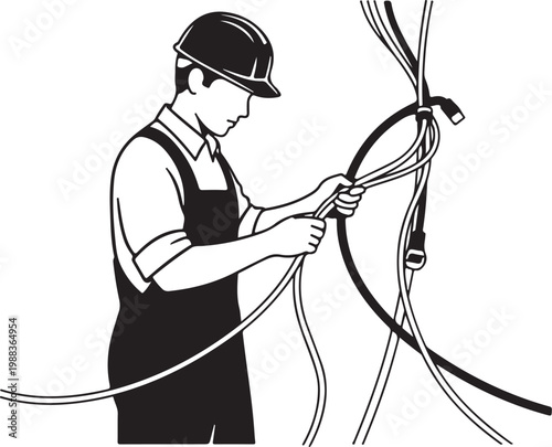 Man in overalls and hard hat working with electrical wires