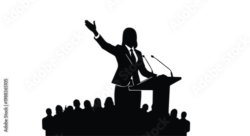 Businessman speaker giving presentation to audience at podium with microphone in conference or meeting setting with gesture