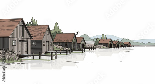 Rustic wooden boathouses line a calm, reflective waterfront under a distant, hazy landscape