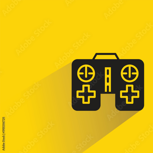 game joystick icon with drop shadow on yellow background
