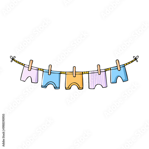 Childrens underwear hanging on a clothesline with clothespins
