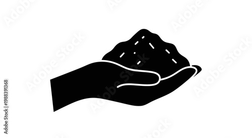 Silhouette of Hand Holding Soil or Granular Substance