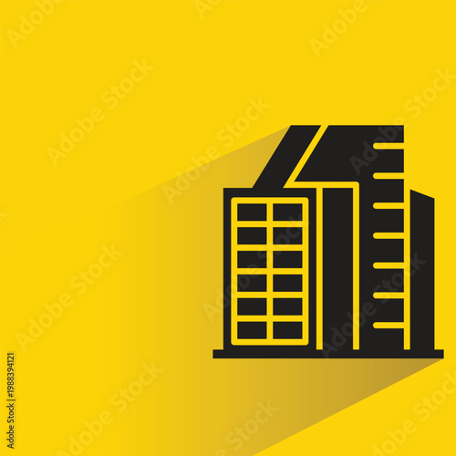 apartment and office tower icon with shadow on yellow background