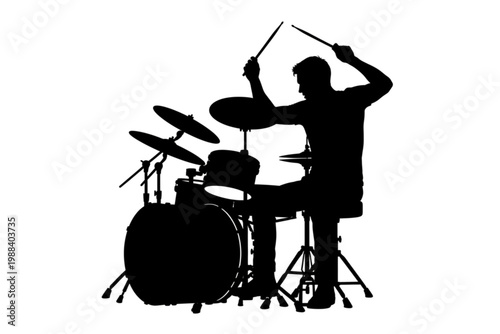 Rhythmic Silhouette: The energetic silhouette of a drummer, passionately immersed in a musical performance, poised amidst the drum set.