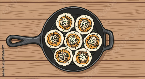 Overhead view of seven savory bites in a black cast iron skillet on wood