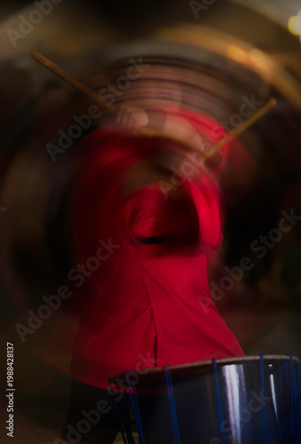 Motion Blur of a Energetic Percussionist in Red Dress