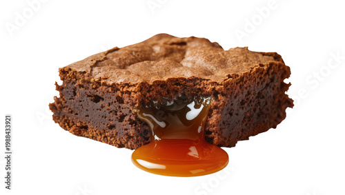 Картината върху платно Rich chocolate brownie with gooey caramel sauce dripping, isolated on transparen