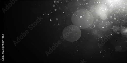 A dark night sky with moon and stars glowing through clouds