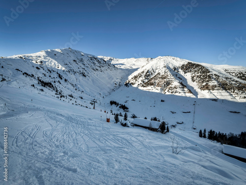 Alpine Beauty: Snow-Covered Peaks and Ski Trails in the Mountains