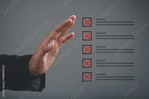 Business decision making, rejection with hand stopping checklist items marked with red cross, representing evaluation, risk control, management review, problem filtering, strategic selection process.