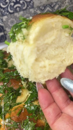 Cooking pampushky traditional Ukrainian garlic buns