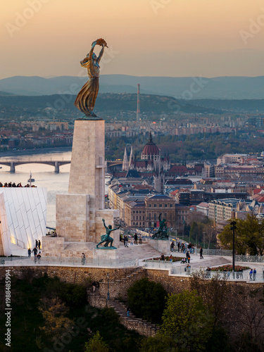 Renovated Liberty Statue, Szabadság Szobor, Citadella visitor center and Hungarian flag on Gellért Hill in Budapest, Hungary.