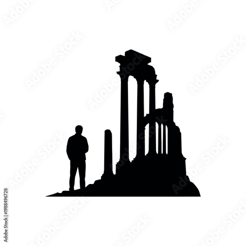 Man standing beside ancient stone columns.