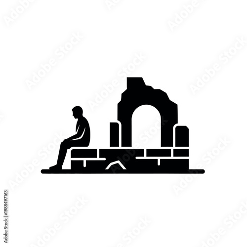 Silhouette of a person sitting next to ancient ruins.