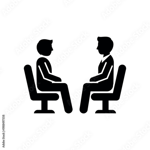 Two businessmen sitting in chairs facing.