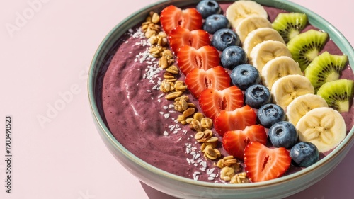 Vibrant smoothie bowl with fruit and granola toppings