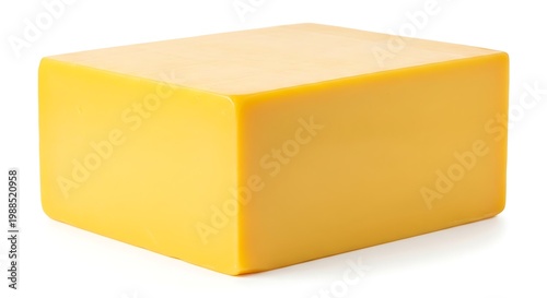 Yellow block of cheese on white.