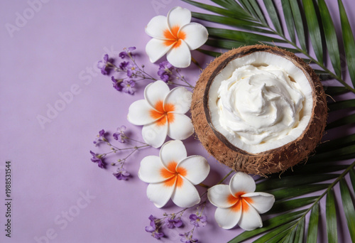 Coconut cream with tropical flowers on purple background for skincare concepts