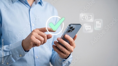 Man in blue shirt using smartphone with green checkmark on screen for mobile payment or verification