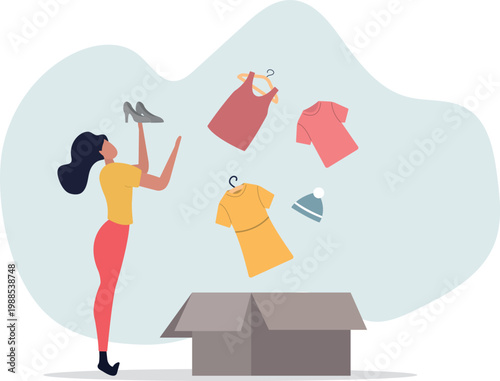 donation concept.Volunteer collecting and packing used clothes in boxes for charity.person's life situation and his activities.