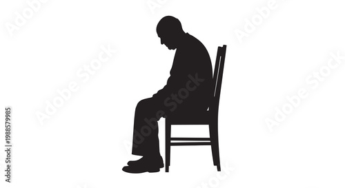 Silhouette of a man sitting in a chair with his head down