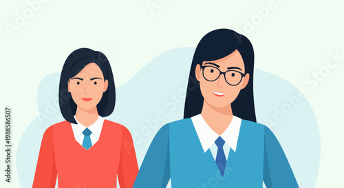 Two women, one with glasses, stand close together in front of a light blue backdrop