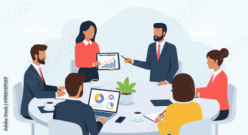 Diverse professionals in business attire collaborate around a table, analyzing data on screens and tablets