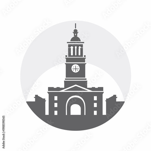 A large clock tower stands prominently in front of an old building.