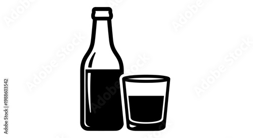 Bottle and glass of dark liquor.