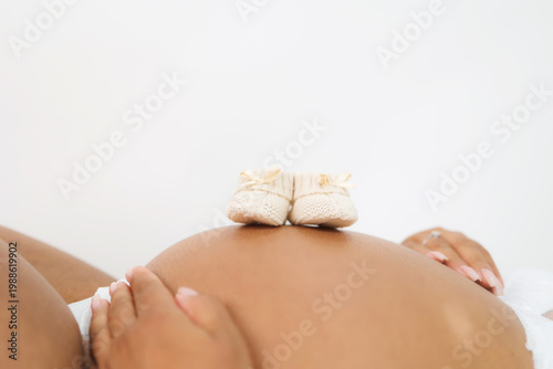Elegant maternity portrait with soft light, feminine beauty and motherhood