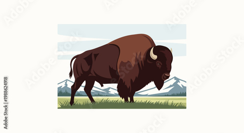 A bison stands in a grassy field with mountains in the background