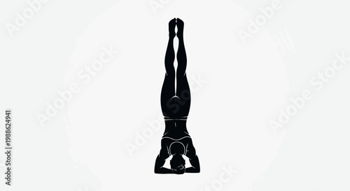 Silhouette of a person in a headstand yoga pose