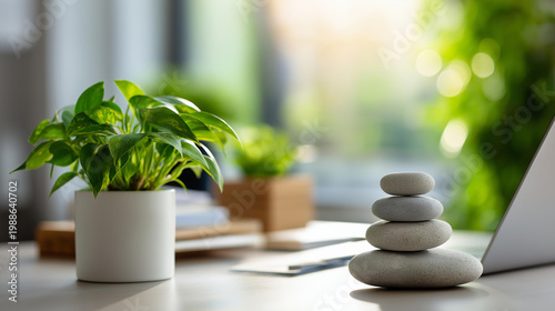 Modern workspace with a desk plant and stone stack for stress-free focus and professional wellness concept, defocused background, with copy space