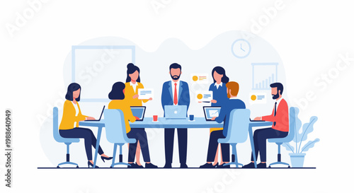 Colleagues in a meeting, discussing strategy around a table with laptops and charts
