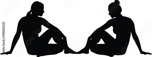 Two individuals sitting in a cross-legged position facing each other in a reflective pose