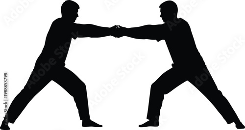 Two individuals engaging in a traditional martial arts grappling technique