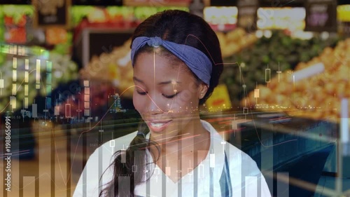 Grocery clerk checking prices, causing price charts floating over, looking up smiling into camera