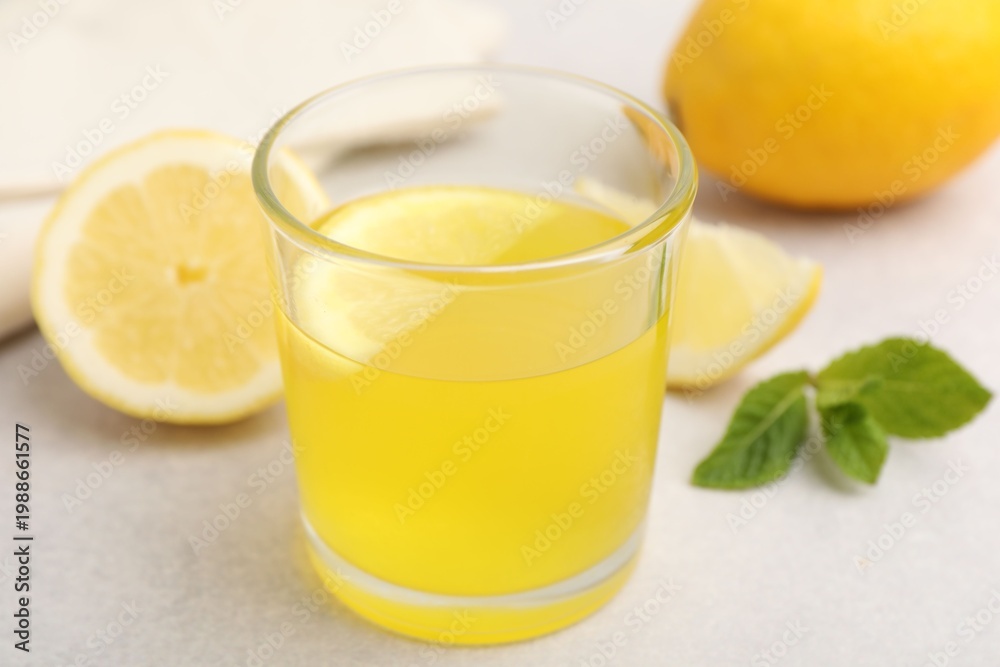 Fototapeta premium Tasty lemon jelly served on white table, closeup