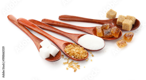 Photos Different types of sugar in spoons isolated on white