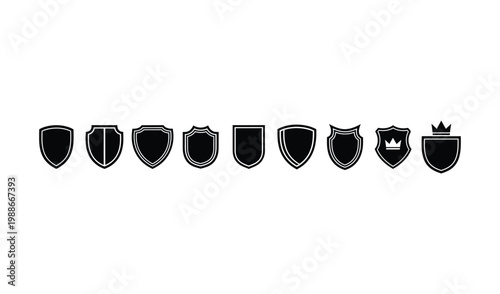 Collection of various black shield icons with different shapes and crown designs on isolated for security and protection concepts