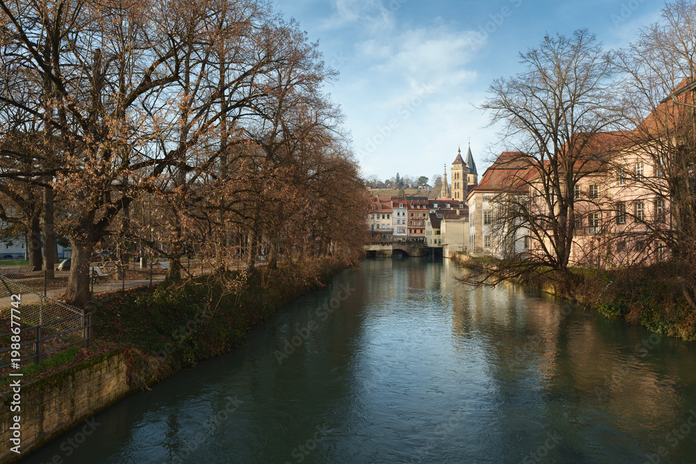 Obraz premium Scenic view of the Neckar canal and historic old town with church spires in Esslingen