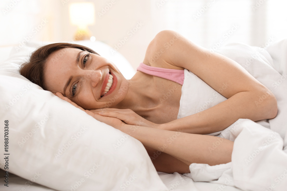 Obraz premium Beautiful woman sleeping in bed at home