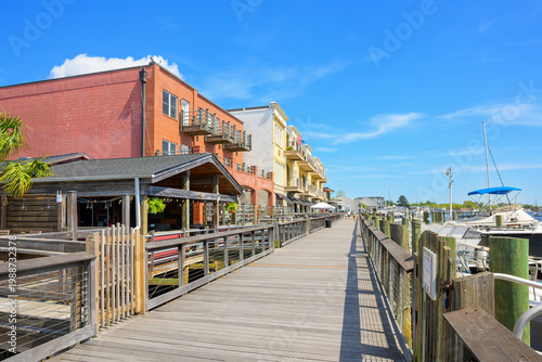 Fotografi Rustic early American themed shops and cafes along the waterfront Harborwalk on the Sampit River in the historic district of Georgetown, South Carolina