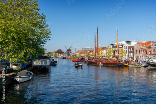 Leiden, Netherlands – September 21, 2024. Kort Galgewater Canal near Leiden City Center. The Kort Galgewater canal with the de Put windmill in the background. Leiden, Netherlands. 
