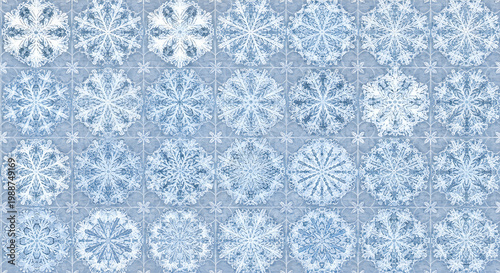 Seamless monochrome snowflake patterns on light gray background for winter design elements