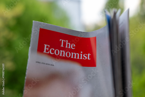 Photos The Economist magazine cover, red banner white serif title, political theme Euro